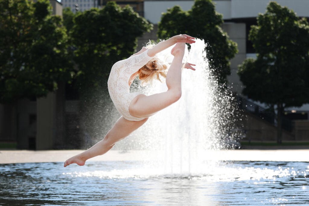 Senior photo of dancer and water fountain