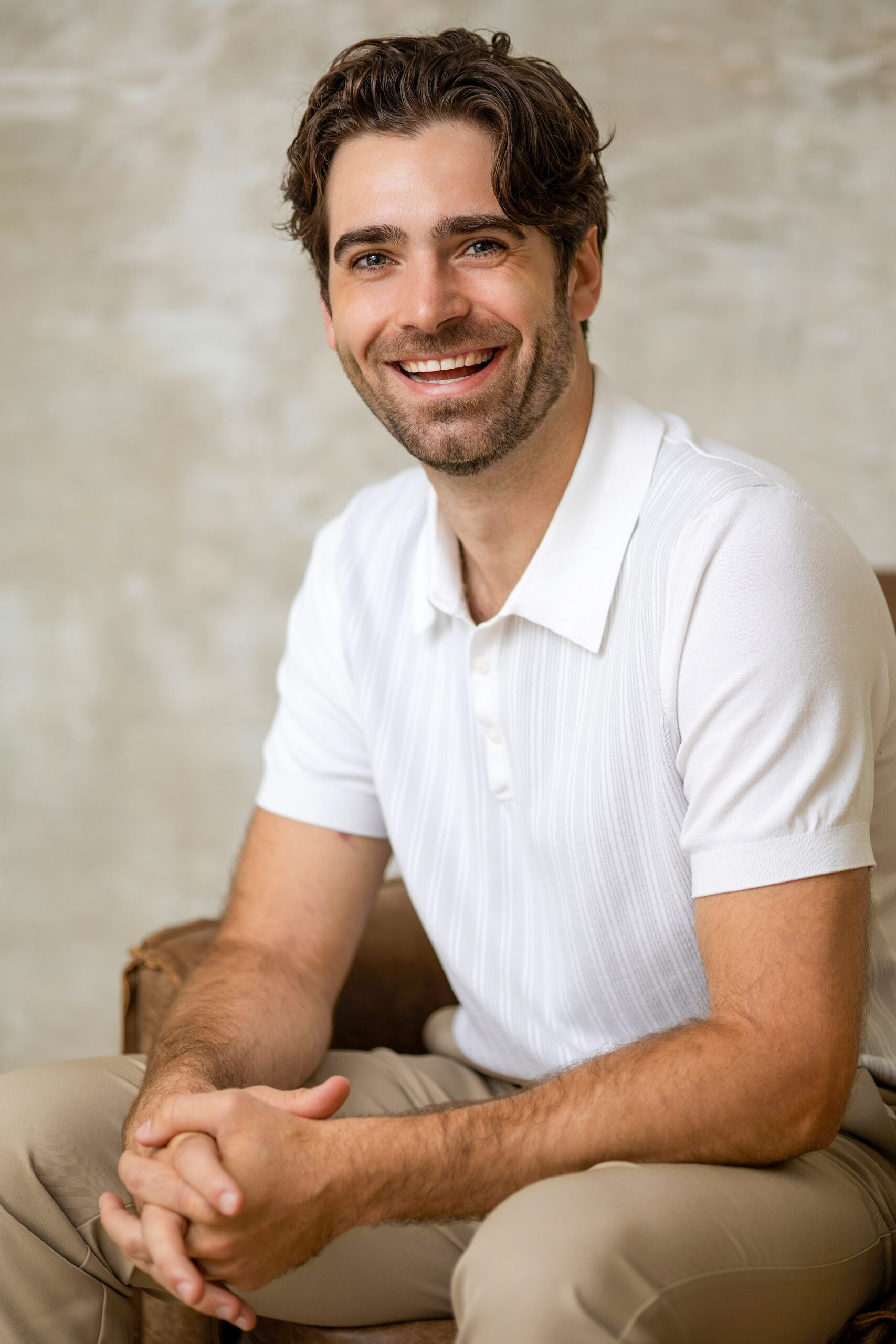 Senior business executive headshot, friendly and approachable smile